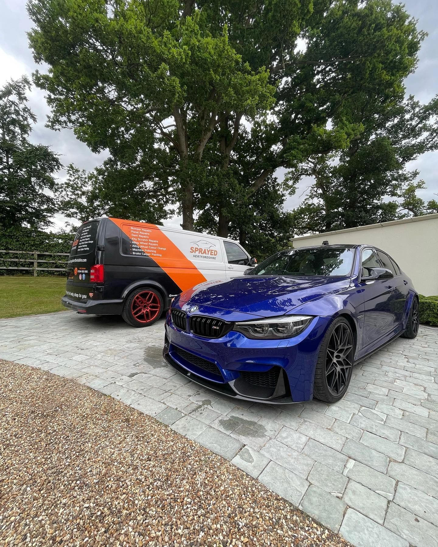 Blue BMW M sport on estate driveway